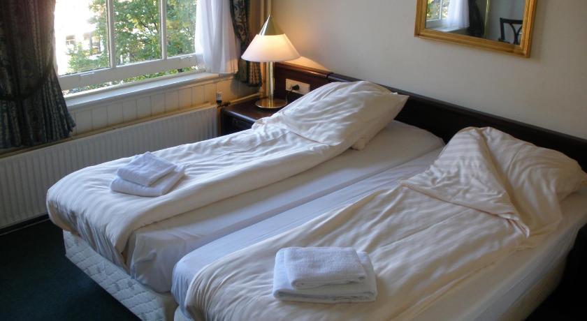 Hotel Prinsenhof Amsterdam Amesterdão Quarto foto